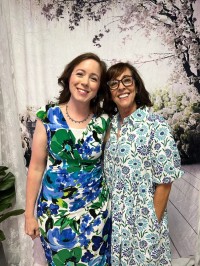 two women pose