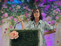 another speaker at the podium