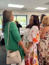 two women greet each other
