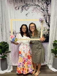 two women pose